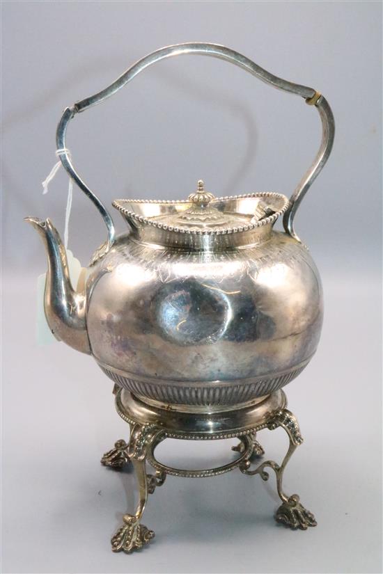 Small silver teapot on stand